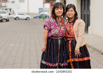 Young Women With Their Typical Mayan Dress Smiling At The Camera - Happy Hispanic Sisters In The Village In Latin America