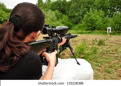 Young Women Training With Gun