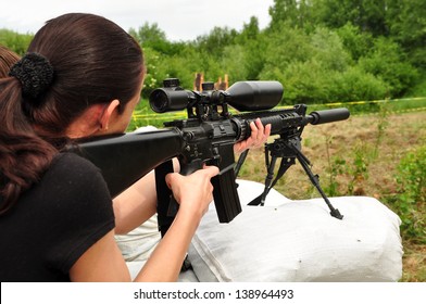 Young Women Training With Gun