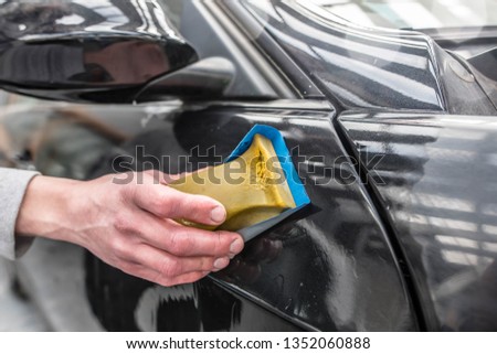 young worker in bodywork