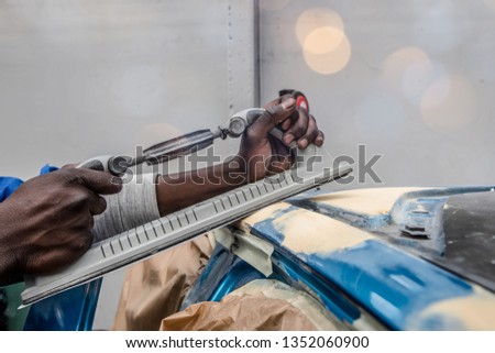 young worker in bodywork