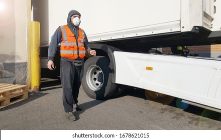 Young Worker At Express Courier With Coronavirus Protection Mask