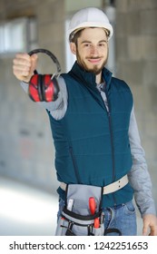 Young Worker With Noise Cancelling Headphones