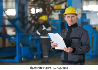 Young Worker Reading Paper Documents While Stock Photo 1077204158 ...