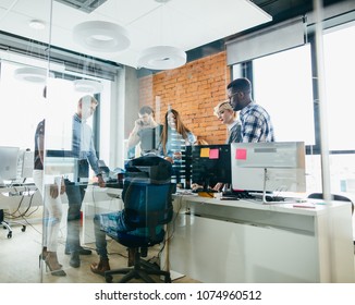 Young Workers Discussing Their Plan Indoors Stock Photo 1074960512 ...