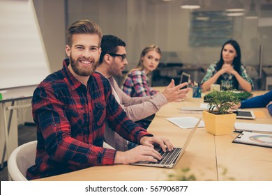 Young Workers Gathering In The Conference Room And Working Hard And Using Laptop For Training.