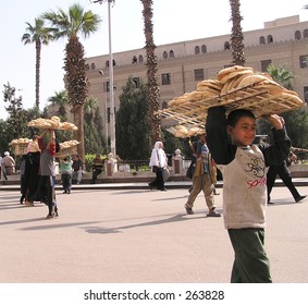 Young working boys selling bread on the street of Cairo, Egypt