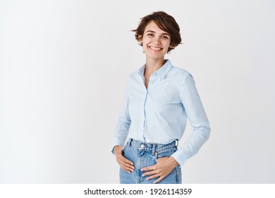 Young Working Woman In Office Clothing, Smiling And Looking At Camera, Standing On White Background. Professional Women Concept.