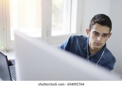 young working with your computer at home or in the office man