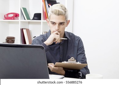 young working with your portable computer at home or in the office man