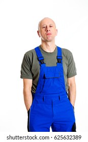 Young Workman In Blue Dungarees In Front Of White Background