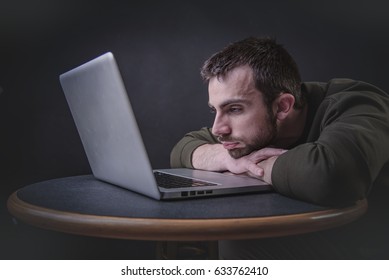 Young Writer Having A Writer's Block, Feeling Bored And Uninspired In Front Of His Computer