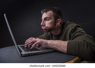 Young Writer Having A Writer's Block, Feeling Bored And Uninspired In Front Of His Computer