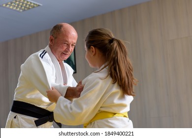 Young Yellow Belt  Judo Girl Sparring With Old Sensei