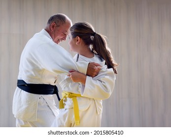 Young Yellow Belt  Judo Girl Sparring With Old Sensei