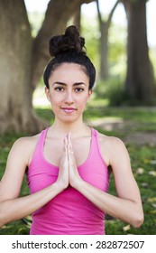 Young Yoga Teacher Practicing Outdoors In A Park In Barcelona