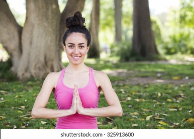 Young Yoga Teacher Practicing Outdoors In A Park In Barcelona