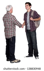 Younger And Older Men Shaking Hands