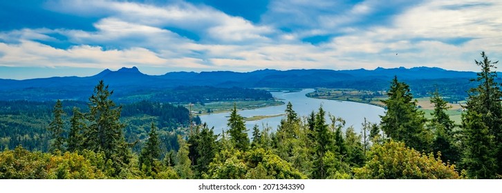 The Youngs River And Surrounding Farm Land Viewed From Top Of Coxcomb Hill In Astoria Oregon.  Saddle Mountain Is On The Ridge Line.