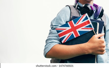Youngster with school stuff demonstrating United Kingdom flag closeup - Shutterstock ID 1474760021