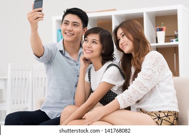 Youngsters Taking Photo Of Themselves Inside