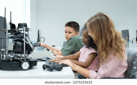 Youngsters utilizing the hand robot technology are having fun learning the electronic circuit board and hand robot controller of robot technology, which is one of the STEM courses.