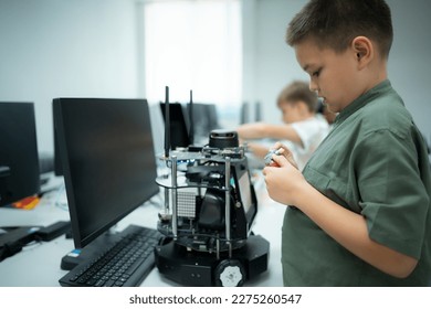 Youngsters utilizing the hand robot technology are having fun learning the hand robot controller of robot technology, which is one of the STEM courses.