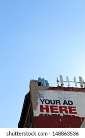Your ad here sign as seen on the side of an old city building. Plent of copy space for your text or mockup ad design.