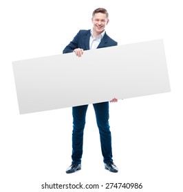 Your advertisement in good hands. Handsome young business man holding big blank with copy space. Isolated on white. - Powered by Shutterstock