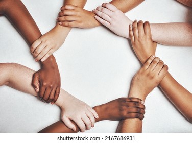 Your circle should be what motivates you. Shot of a group of hands holding on to each other against a white background. - Powered by Shutterstock