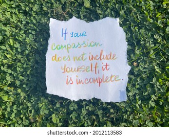 If your compassion does not include yourself, it is incomplete. Handwritten message. Green grass as background.