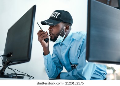 Your direct connection to first rate protection. Shot of a young security guard using a two way radio while monitoring the cctv cameras. - Powered by Shutterstock