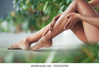 Your legs need some loving too. Cropped shot of an unrecognizable woman touching her legs. - Shutterstock ID 2121541334