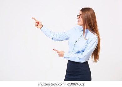 Your Logo Or Product Goes Here! Studio Shot Of Beautiful Young Business Woman Holding Her Arm Up Presenting Copyspace.