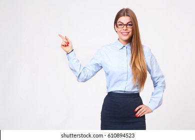 Your Logo Or Product Goes Here! Studio Shot Of Beautiful Young Business Woman Holding Her Arm Up Presenting Copyspace.