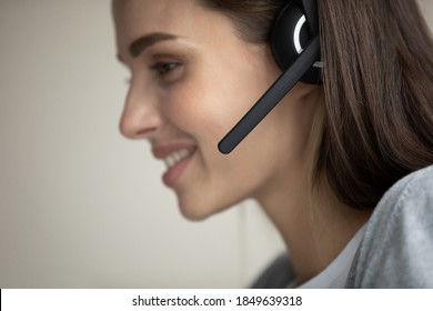 I Am Your Personal Advisor. Profile Shot Of Smiling Young Female In Portable Wireless Headphone Set On Head Speaking To Microphone Making Answering Call, Willing To Help Assist Consult Client Customer