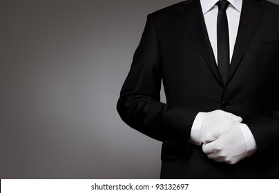 At Your service. Waiter, or well dressed man waiting for orders with copy space