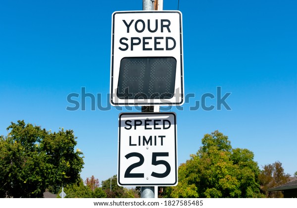 Your Speed, a radar speed sign that\
displays vehicle speed as motorists approach. 25 mph speed limit\
sign in residential\
neighborhood.