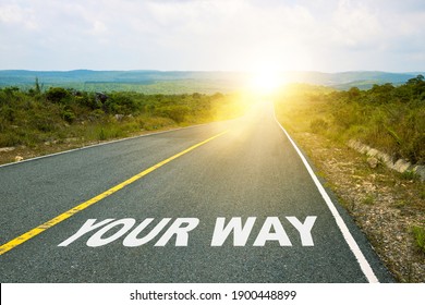 Your Way, Concept Photo Of Asphalt Road. Motivational Inscription On The Road Going Forward. The Beginning Of A New Path. A Conceptual Photo Of The Path Leading To A Bright Future.