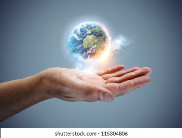 Your World -  The planet earth hovering in a hand.