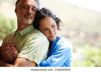 Youre all I need. A cropped shot of an affectionate mid adult couple holding each other outdoors. - Shutterstock ID 2140195653