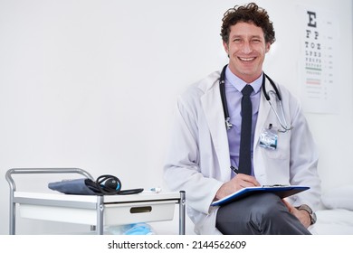 Youre In Good Hands. Portrait Of A Male Doctor Reading A Report.