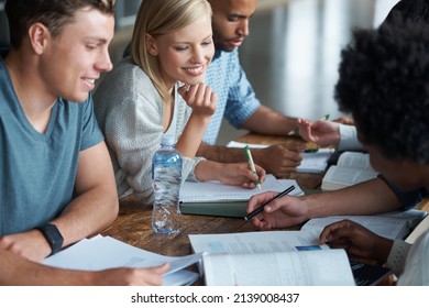 Youre making this look too easy. A group of college students sitting together and studying.