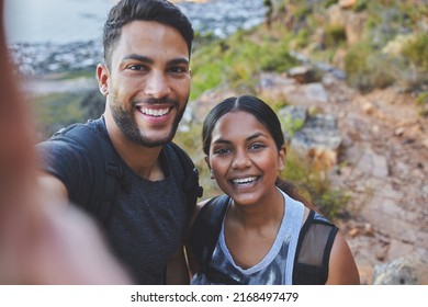 Youre My Favourite Person To Hike With. Shot Of A Young Couple Taking Photos While Out On A Hike In A Mountain Range Outside.