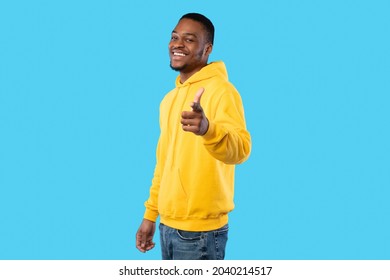 You're Next. Cheerful African American Millennial Man Pointing Finger Smiling To Camera Choosing You Standing Over Blue Background In Studio. Bright Advertisement Banner