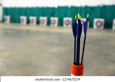 Youth Archery Arrows In Quiver On Range With Targets In Background