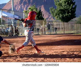 Youth Baseball Batter Swing And A Miss