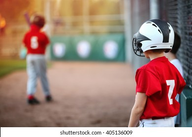 Youth Baseball player waiting on deck in batting line up, focus on boys shoulder