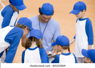 Youth Baseball Team And Coach On Pitch