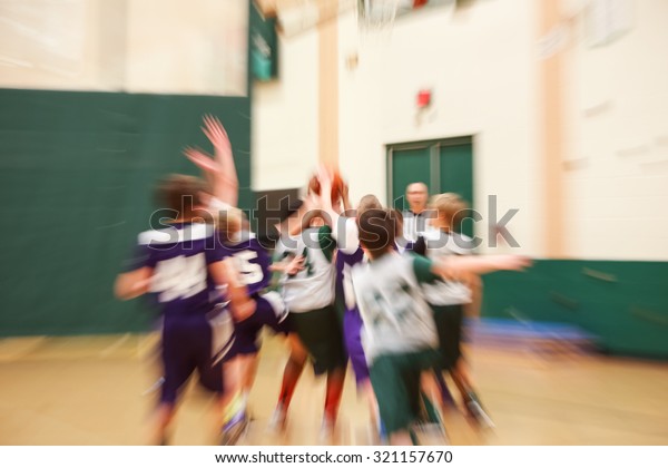 Youth\
basketball motion blurred image, lens\
effect.
